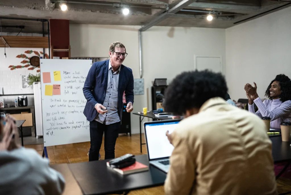 Teacher staying updated with PTE news and resources via calendar and mobile notifications