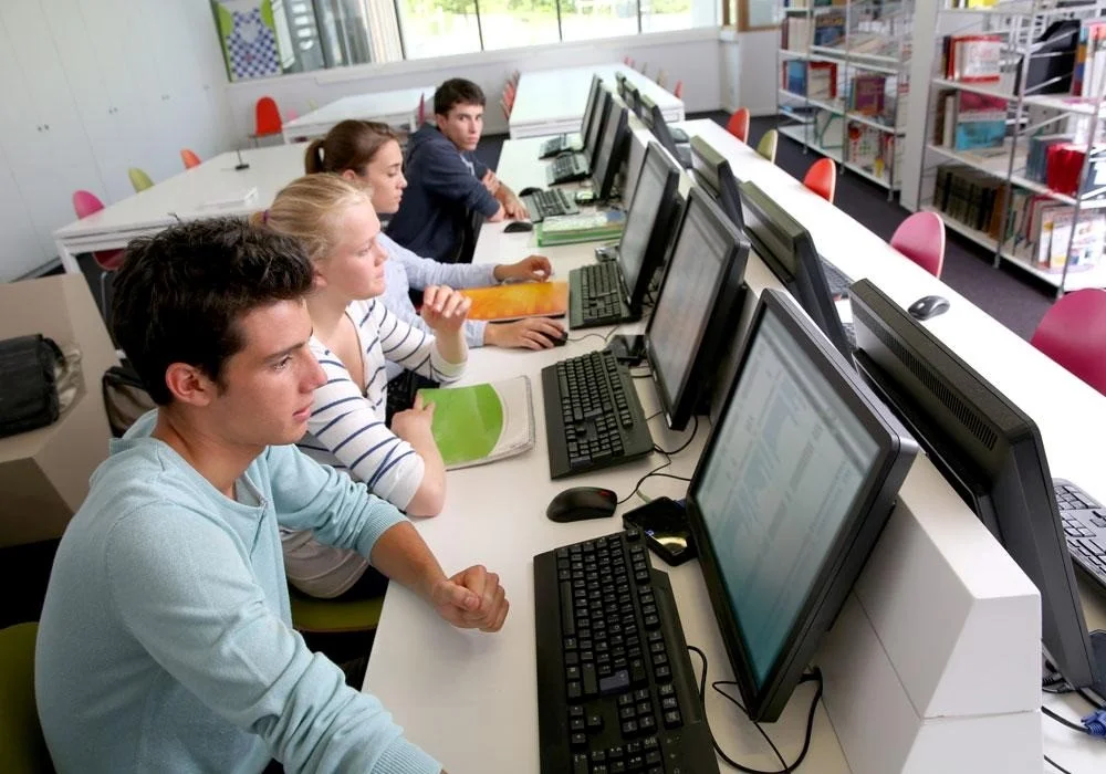 Learners practicing computer-based PTE test