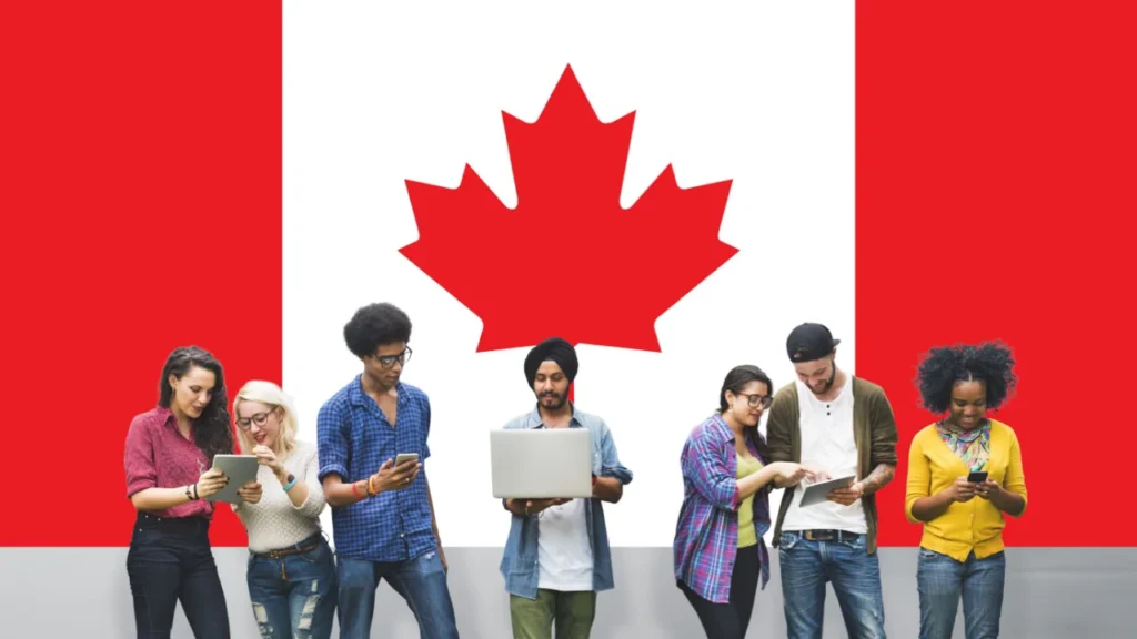 International students standing together with a large Canadian flag background